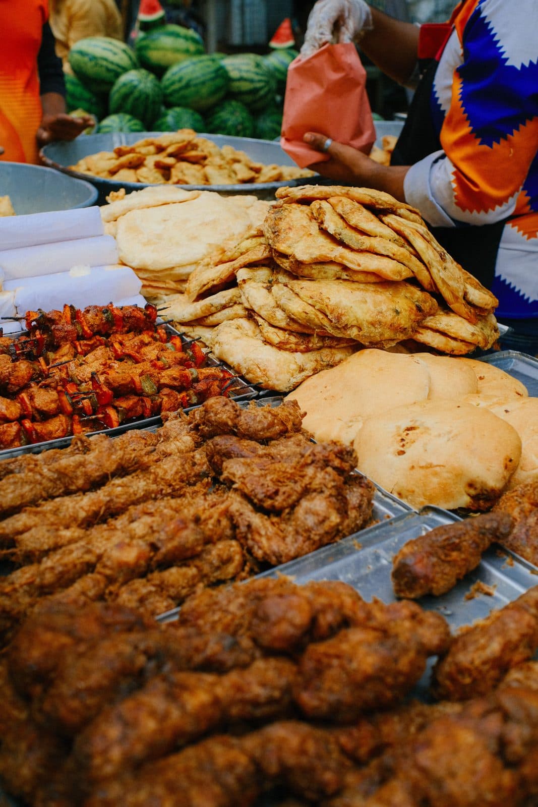Grilled meats, skewers and fresh breads on a buffet